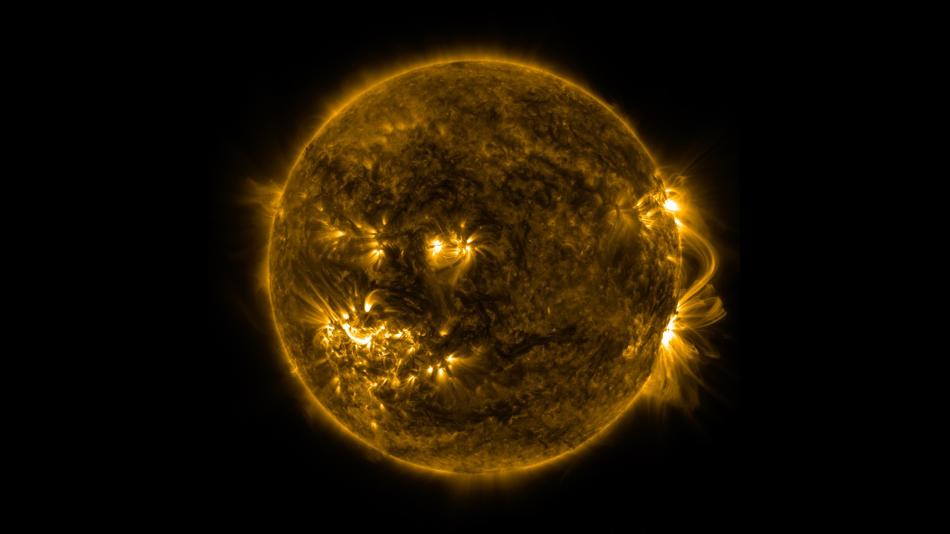 Eine gelb leuchtende Kugel vor schwarzem Hintergrund