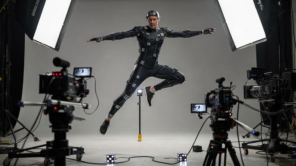 Person in Motion-Capture-Anzug macht eine Sprungbewegung in einem Videostudio